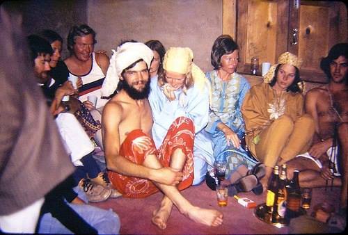 A group of hippie travellers enjoying Pakistani beer at a rest house in North Pakistan (1974)