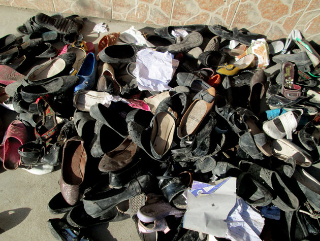Shoes of Afghan school girls are seen on the ground after an earthquake hit in Takhar province, northeast of Kabul, Afghanistan, Monday, Oct. 26, 2015. In Afghanistan's Takhar province, west of Badakhshan, at least 12 students at a girls' school were killed in a stampede as they tried to get out of the shaking buildings, a local official says. Sonatullah Taimor, the spokesman for the Takhar provincial governor, says another 30 girls have been taken to the hospital in the provincial capital of Taluqan. (AP Photo/Naim Rahimi)