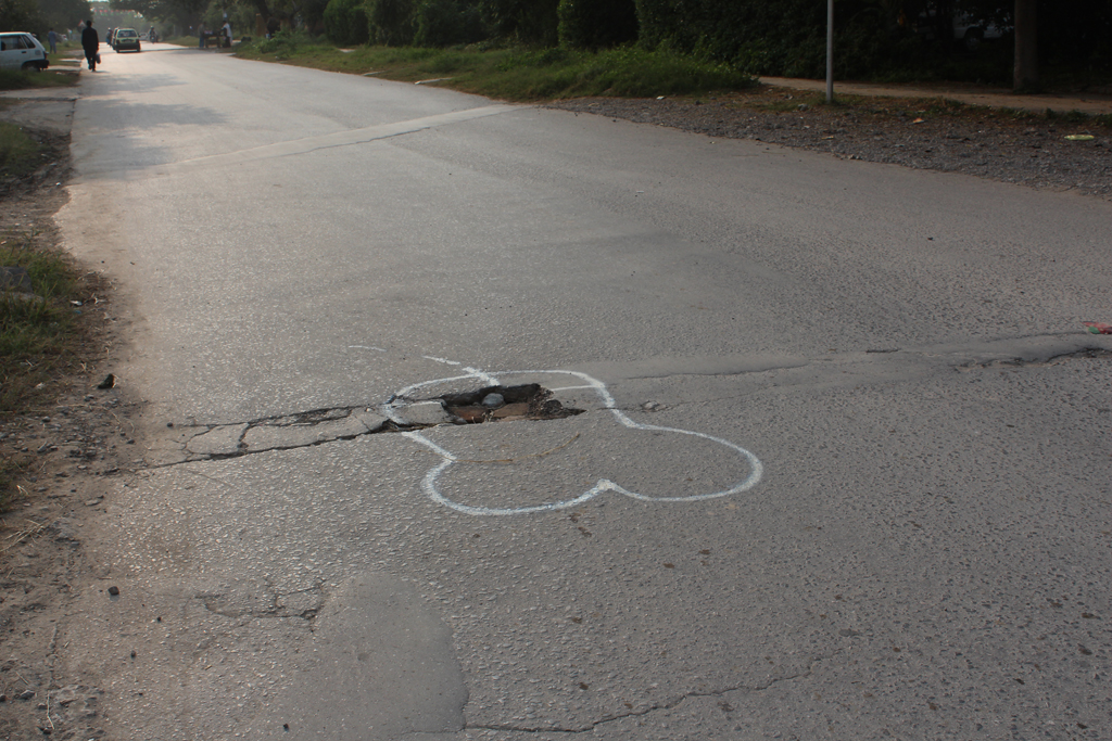 Mystery artist in Islamabad draws penises around potholes so the city will fix them