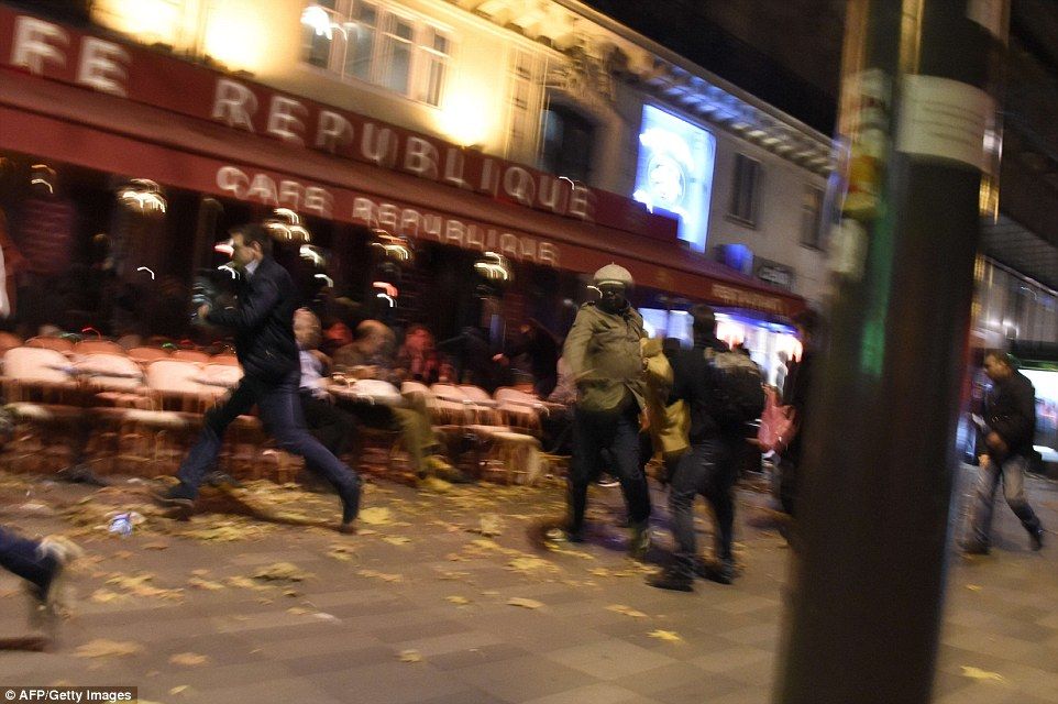 People run after hearing what is believed to be explosions or gun shots near Place de la Republique square in Paris.