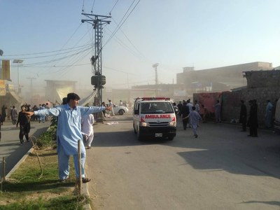Ambulances transport injured individuals from the blast site.