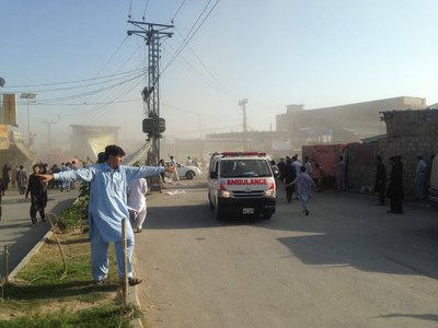 Ambulances transport injured individuals from the blast site.